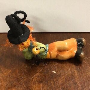Playful Halloween Figurine with Black Hat and Orange Pants